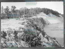 The upper bay embankment. July 1900. where the penstocks will run through to the mill of the Belg...